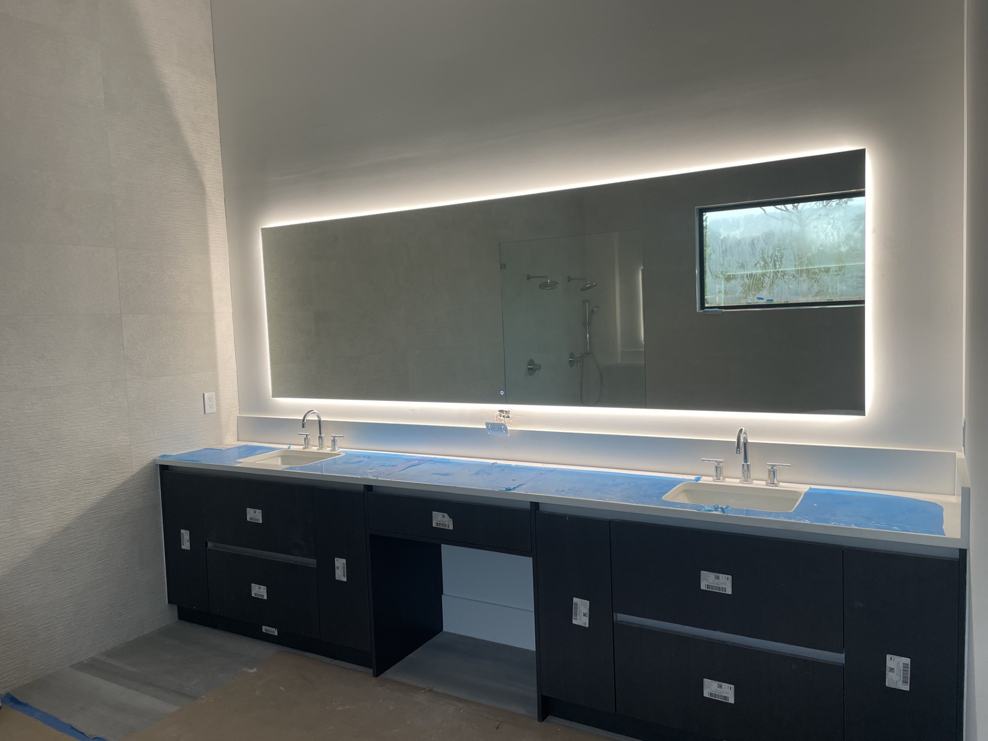Custom-cut glass mirror installed by RG Glass