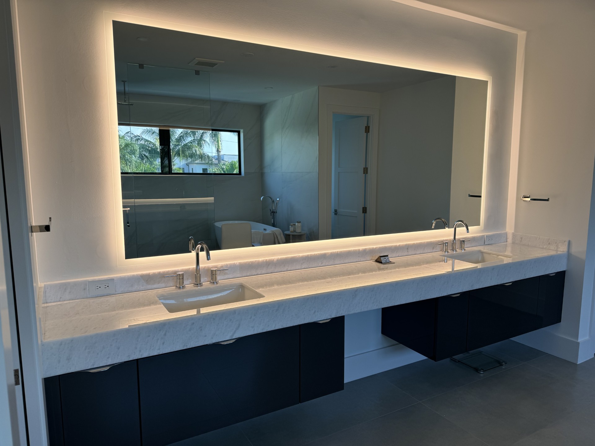 Custom-cut glass mirror installed by RG Glass