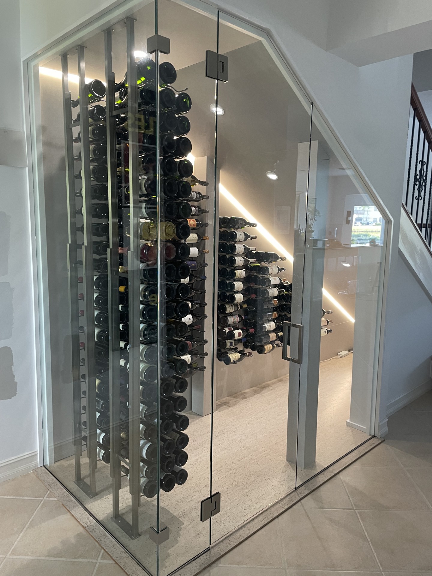Glass-enclosed wine room by RG Glass