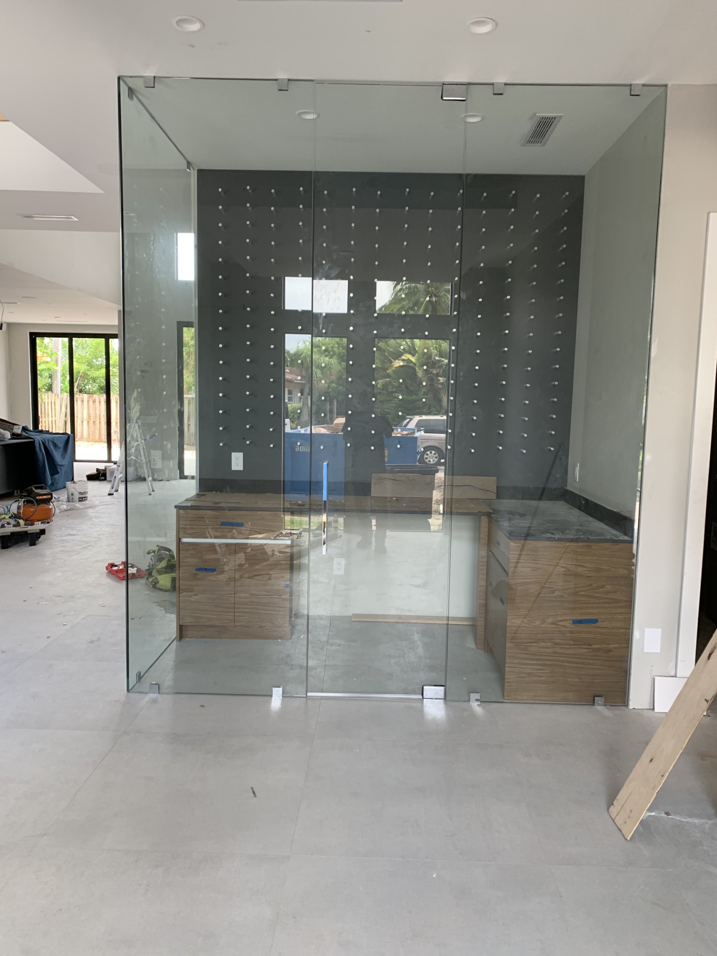 Glass-enclosed wine room by RG Glass