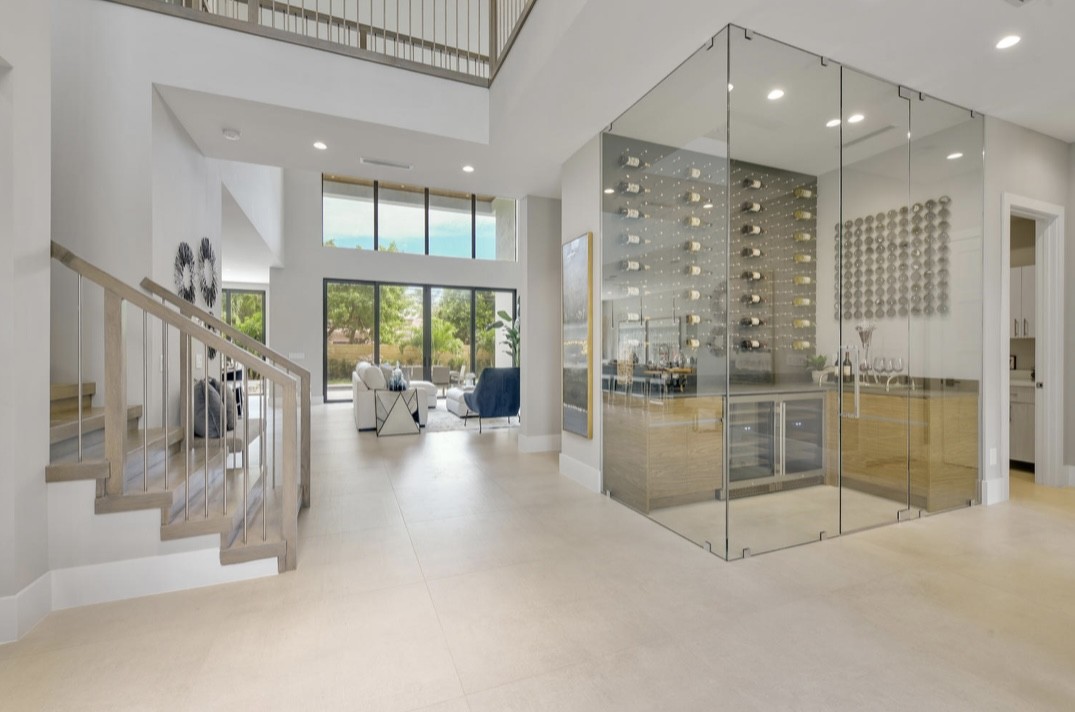 Glass-enclosed wine room by RG Glass